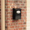 Designer wall mount mailbox on a brick wall