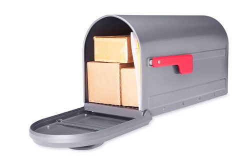 Open gray mailbox with packages inside