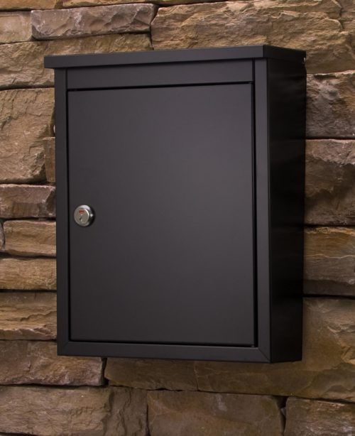 Black wall mount mailbox on wall