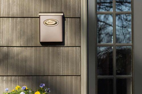 Decorative background of brown wall mount mailbox