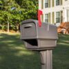 Zoomed in image of brown mailbox in front of house